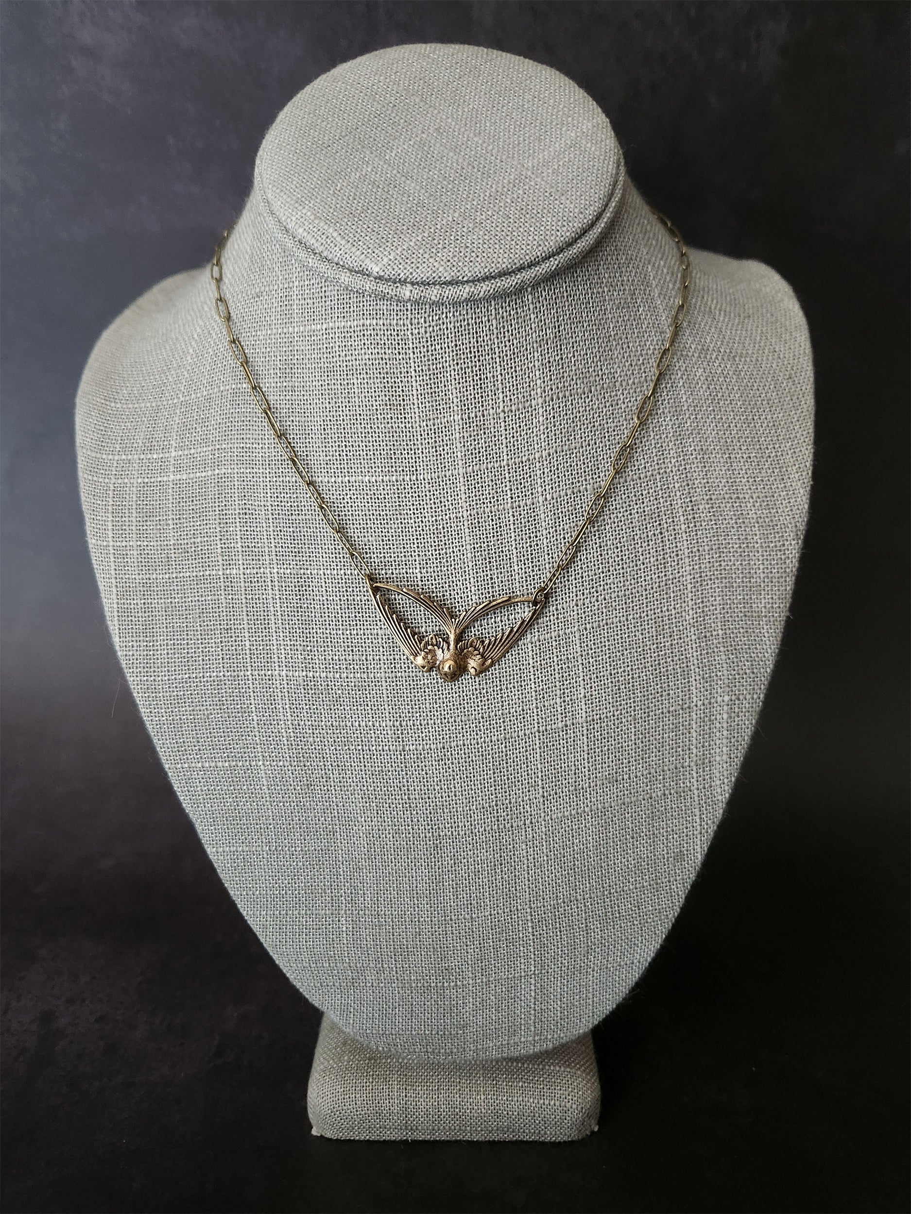 geo swallow necklace